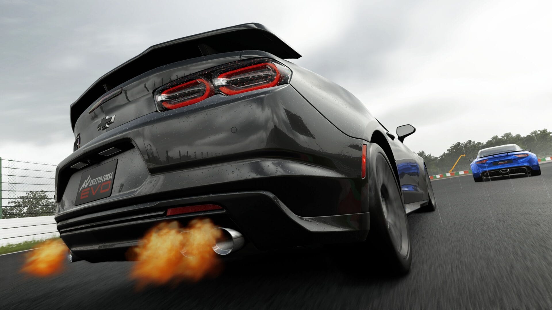 close-up of a backfire captured in-game from Assetto Corsa EVO, with bright flames shooting from the tailpipe during high-speed racing, highlighting the intense action and realistic engine effects