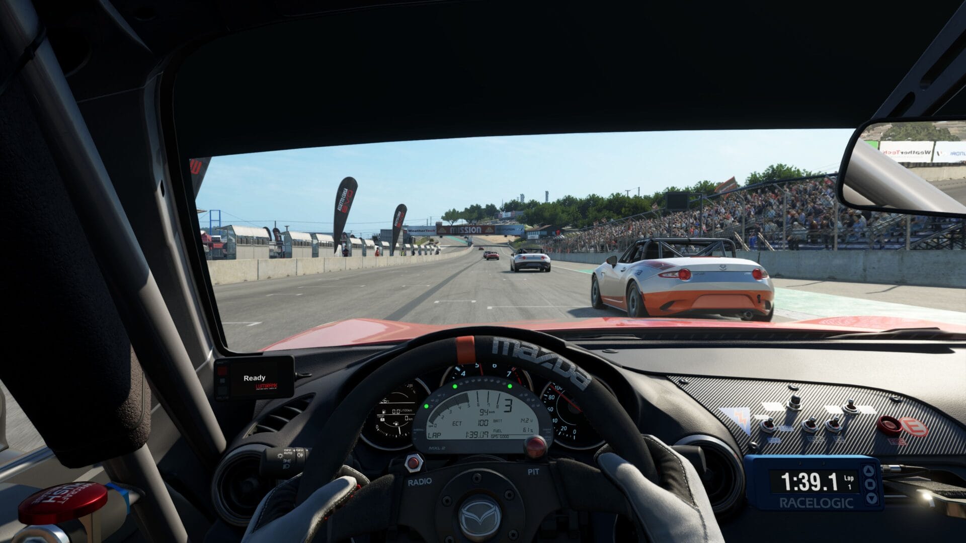 Interior view of a Mazda racing car during a race scene in Assetto Corsa EVO, in high-speed action